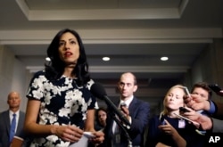 FILE - Huma Abedin, a longtime aide to Hillary Rodham Clinton, speaks to the media after testifying at a closed-door hearing of the House Benghazi Committee, on Capitol Hill, Oct. 16, 2015 in Washington.