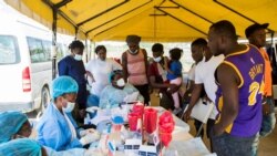 Haitian migrants gather to be tested for COVID-19 after U.S. authorities flew them out of a Texas border city, at Toussaint Louverture International Airport in Port-au-Prince, Haiti Sept. 21, 2021.