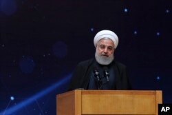 FILE - In this photo released by the official website of the office of the Iranian Presidency, President Hassan Rouhani speaks during a ceremony marking "National Nuclear Technology Day," in Tehran, Iran, April 9, 2019.