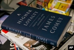 A copy of former FBI Director James Comey's new book, "A Higher Loyalty: Truth, Lies and Leadership," is on display, Apr. 13, 2018, in New York.