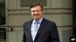 FILE - Paul Manafort, President Donald Trump's former campaign chairman, leaves the Federal District Court in Washington after a hearing, May 23, 2018.