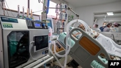 Switzerland-based drug company Roche says a medicine it sells to tamp down inflammation has helped prevent the need for breathing machines in hospitalized COVID-19 patients in the first large study that primarily enrolled Hispanics and Blacks. 