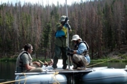 University of Montana professor Philip Higuera, right, and his team collect lake sediment from Chickaree Lake in Rocky Mountain National Park, used to reconstruct fire and vegetation history. (Grace Carter photo; image courtesy of Philip Higuera)