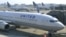 FILE - United Airlines will cease flights to Lagos, Nigeria's largest city, in June. 