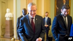 Senate Majority Leader Harry Reid,walks to a Senate Democratic caucus to discuss the ongoing budget fight, Monday, Sept. 30, 2013, on Capitol Hill in Washington. 