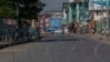 A barbwire blocks a deserted street on the first anniversary of India’s decision to revoke the disputed region’s semi-autonomy, in Srinagar, Indian controlled Kashmir, Aug. 5, 2020.