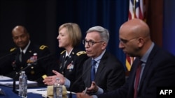 From left, Brigadier General Michael J. Talley, Colonel Wendy Sammons-Jackson, Dr. Nelson Michael and Dr. Kayvon Modjarrad hold a press conference on the coronavirus pandemic at the Pentagon on March 5, 2020. 
