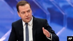 Russia's Prime Minister Dmitry Medvedev speaks during a nationwide live TV show at Moscow's Ostankino TV center, Dec. 10, 2014.