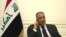 FILE - Iraqi Prime Minister Mustafa al-Kadhimi is pictured at his office in Baghdad, Iraq, May 9, 2020, in this government handout photo.