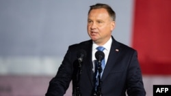 FILE - Polish President Andrzej Duda speaks to a crowd during an event in Gdansk-Westerplatte, Sept. 1, 2020.
