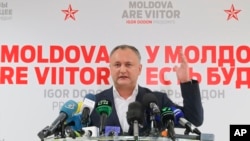 Socialist Party presidential candidate Igor Dodon speaks to the media after voting ended in the presidential elections, in Chisinau, Moldova, Nov. 13, 2016. 