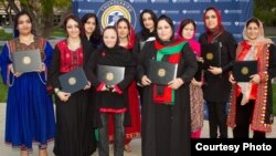 Graduates of the 2013 class of Project Artemis are seen with their diplomas. (Courtesy Thunderbird School of Global Management) 