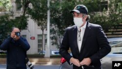 FILE - Michael Cohen arrives at his apartment in New York City, May 21, 2020.