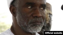 New York Police Department officers stand watch from a building as a float proceeds high above spectators along 6th Ave during the 89th Macy's Thanksgiving Day Parade in the Manhattan borough of New York.