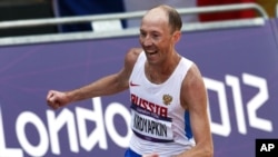 Russian athlete Sergei Kirdyapkin, seen in this file photo when he won the gold medal in the men's 50-kilometer race walk at the 2012 Summer Olympics in London, would be stripped off his medal according to Court of Arbitration for Sport (CAS).