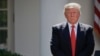 FILE - President Donald Trump stands next to the podium after speaking about the U.S. role in the Paris climate change accord in the Rose Garden of the White House in Washington, June 1, 2017. 