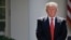 FILE - President Donald Trump stands next to the podium after speaking about the U.S. role in the Paris climate change accord in the Rose Garden of the White House in Washington, June 1, 2017. 