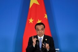 FILE PHOTO: China's Premier Li Keqiang speaks during a joint news conference at the 8th trilateral leaders' meeting between China, South Korea and Japan in Chengdu, in southwest China's Sichuan province, Dec. 24, 2019.