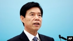 Chinese Commerce Minister Zhong Shan says, March 11, 2018, Beijing will defend its national interest in the face of growing American protectionism.