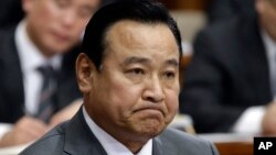 South Korea's new Prime Minister nominee Lee Wan Koo listens to a question during a confirmation hearing in order to examine his qualification at the National Assembly in Seoul, South Korea, Tuesday, Feb. 10, 2015.