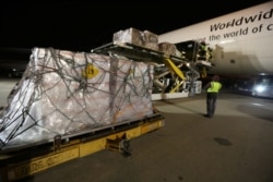 UPS workers load medical masks and other protective gear bound for China into a cargo plane at Hartsfield-Jackson Atlanta International Airport, Georgia, Feb. 1, 2020. (Credit: UPS/Dan McMackin/Handout)