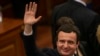 FILE - Albin Kurti, newly elected prime minister of Kosovo, waves after a new government was elected in Pristina, Feb. 3, 2020.