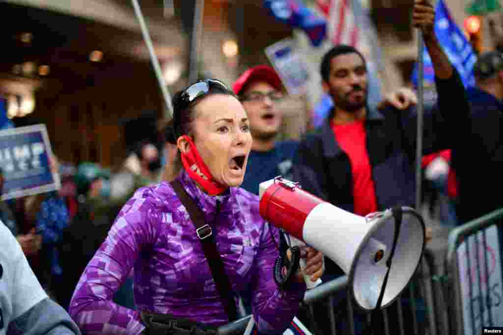 A supporter of President Donald Trump yells at a supporter of Democratic presidential candidate Joe Biden, in Philadelphia, Pennsylvania, Nov. 6, 2020.