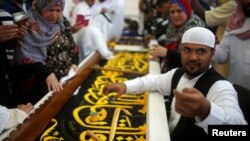 A man embroiders the Kiswa, a silk cloth covering the Holy Kaaba, ahead of the annual haj pilgrimage, at a factory in the holy city of Mecca, Saudi Arabia August 26, 2017. 
