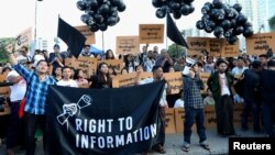 Myanmar press freedom advocates and youth activists hold a demonstration demanding the freedom of two jailed Reuters journalists Wa Lone and Kyaw Soe Oo in Yangon, Myanmar, Sept. 16, 2018. 