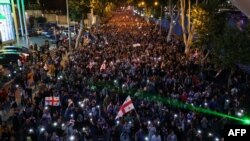 Demonstrators protesting the "foreign influence" law stage a march toward the Georgian Interior Ministry with the demand to release detained fellow protesters, in Tbilisi on May 24, 2024.