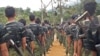 FILE - Arakan Army recruits scale the climbing ropes at the Laiza, Kachin State base camp, in this undated photo. Both the rebel group and the Myanmar military have been accused of forcibly conscripting Rohingya men.