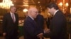FILE - Afghanistan Deputy Foreign Minister, Hekmat Khalil Karzai, right, shakes hands with Sartaj Aziz, adviser to the Pakistani prime minister on foreign affairs, at a January 2016 meeting aimed at laying the roadmap for peace talks with the Taliban, in Islamabad, Pakistan.