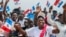FILE - Supporters of the ruling Rwandan Patriotic Front (RPF) cheer during a rally by Rwandan President Paul Kagame in Nyanza, Rwanda, July 14, 2017.
