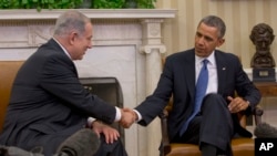 President Barack Obama and Israeli Prime Minister Benjamin Netanyahu shake hands during their meeting in the Oval Office of the White House in Washington.