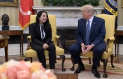 President Donald Trump meets with Aya Hijazi, an Egyptian-American aid worker, in the Oval office of the White House in Washington, April 21, 2017.