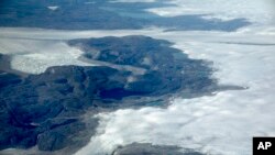 FILE - The Greenland ice sheet is seen in southeastern Greenland, Aug. 3, 2017. 