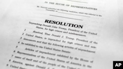 ,A copy of a page of the Articles of Impeachment is seen in Washington, Dec. 10, 2019. 