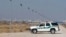 FILE - A U.S. Border Patrol truck sits at the U.S.-Mexico border in El Paso, Texas. 