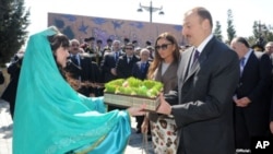 Azerbaijani President Ilham Aliyev and his wife Mehriban Aliyeva attend Norouz festivities in Baku, March 20, 2012.