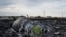 Flowers are placed on a plane engine at the crash site of a Malaysia Airlines jet near the village of Hrabove, eastern Ukraine, July 19, 2014.