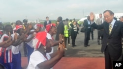 UN Secretary General Ban Ki-moon, is greeted by dancers upon arrival at the Roberts international airport in Monrovia, Liberia, Friday, Dec. 19, 2014.