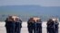 Spanish air force personnel carry the coffins with the bodies of Spanish journalists David Beriain and Roberto Fraile and Irish ONG chief Rory Young, killed in eastern Burkina Faso, after arriving in the Torrejon de Ardoz air base on April 30, 2021. 