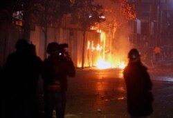 Hezbollah and Amal supporters set fire to trees in Beirut, Dec. 17, 2019. The groups were angered by a video that showed a man insulting Shiite figures.