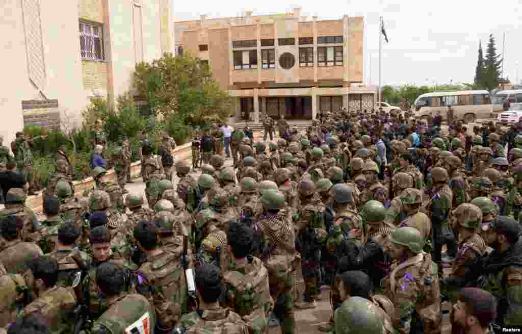 A Syrian Army officer briefs his men to prepare for an offensive in Aleppo's Liramoun area, April 11, 2013.