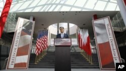 Republican presidential candidate and former Massachusetts Gov. Mitt Romney speaks at the University of Warsaw Library in Warsaw, Poland, July 31, 2012.