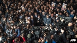 Journalists take photos during a symbolic funeral prayer for Saudi journalist Jamal Khashoggi, killed and dismembered in the Saudi consulate in Istanbul, at the courtyard of Fatih mosque in Istanbul, Nov. 16, 2018.