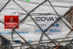 A shipment of COVID-19 vaccines from the COVAX global COVID-19 vaccination program arrives at the Kotoka International Airport in Accra, Ghana, Feb. 24, 2021.