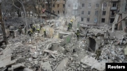 Rescuers work at a site of a residential building destroyed by a Russian missile strike during Russia’s attack on Ukraine, in Kramatorsk, Ukraine, Feb. 2, 2023.