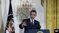 U.S. President Barack Obama answers a question during a news conference at the White House, June 29, 2011