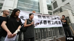 FILE - Hong Kong journalists protest suppression by mainland authorities in 2012.